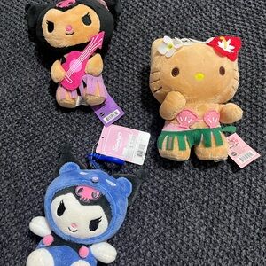 Two Hawaii plushies and one from Sanrio